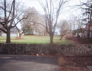 Back of House Which Ends at Stone Wall
